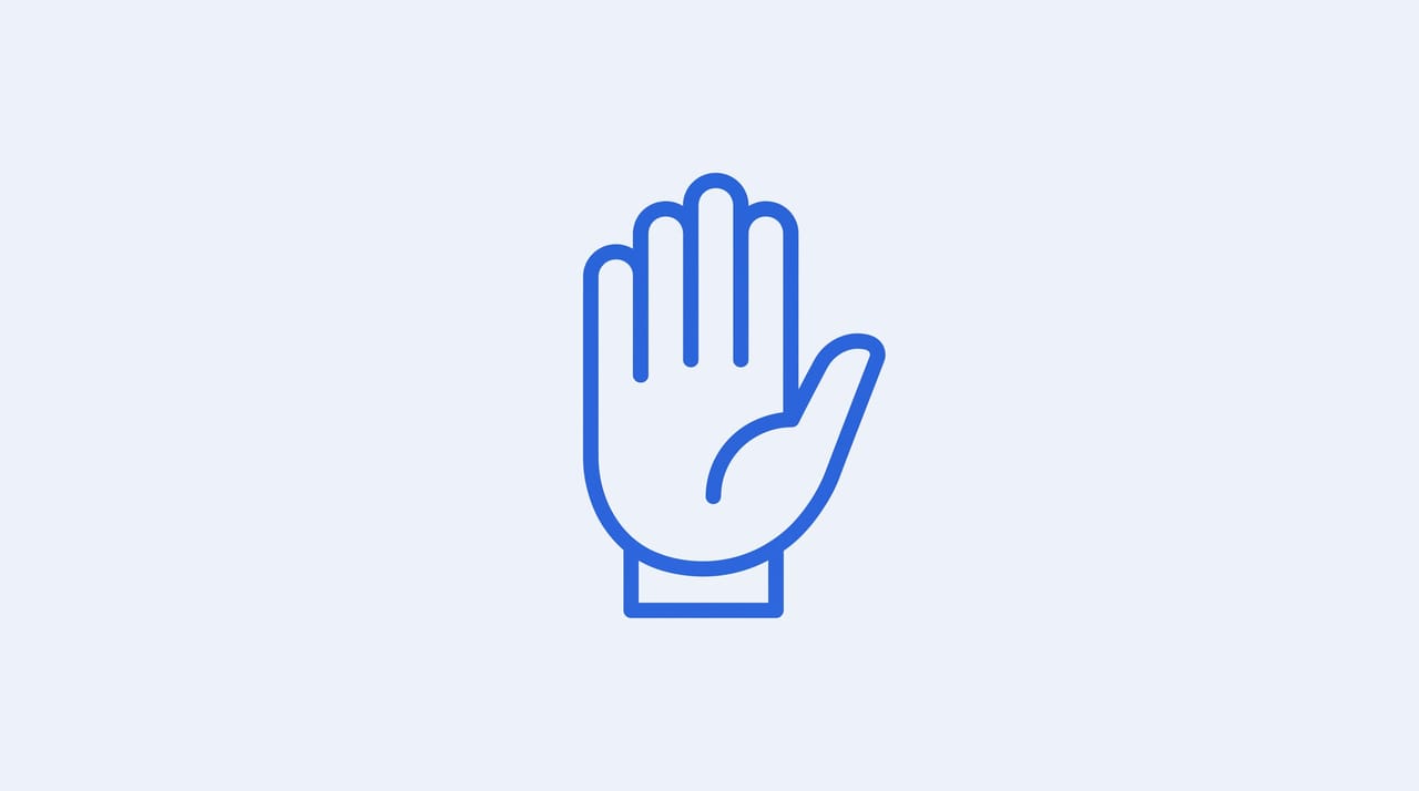 A person's hand politely declining an overloaded calendar full of meeting invites, keeping one block of focused time protected